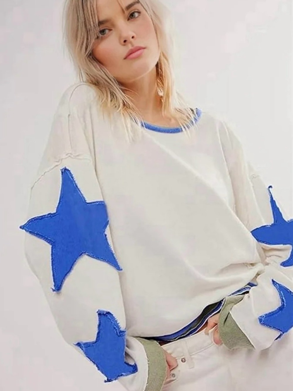 Amazon White Sweatshirt with Blue Star Sleeves